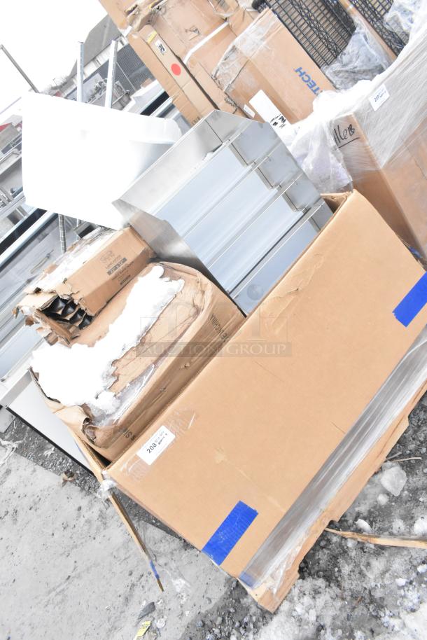 9 new scratch and dent items; includes Cambro catering case, ingredient bin, bun warmer, trays in boxes; mixed condition.