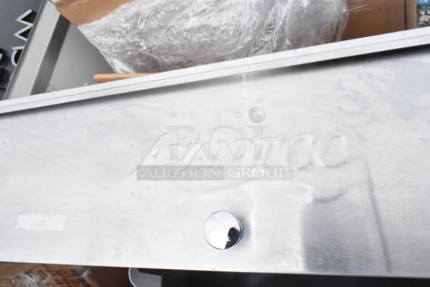 Avantco logo on a metal surface, likely part of a new catering or kitchen equipment item.