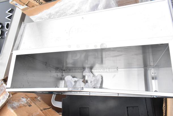 Brand new Cambro front load catering case, steel finish, visible scuffs; part of scratch and dent auction lot.