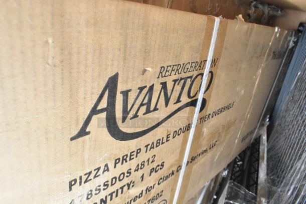 Cardboard box labeled "Avantco Refrigeration Pizza Prep Table" with minor scratches and dents.