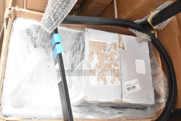 Box containing 10 brand new scratch and dent items, including an evaporator coil and scale, with visible labels and protective packaging.