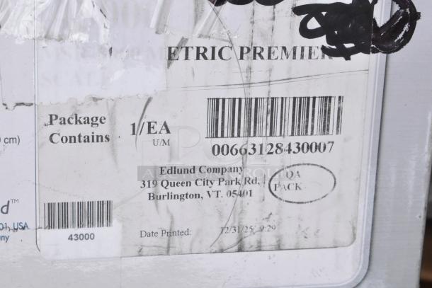 Label showing Edlund Company, 319 Queen City Park Rd, Burlington, VT, with barcode 00663128430007 and QA Pack stamp.