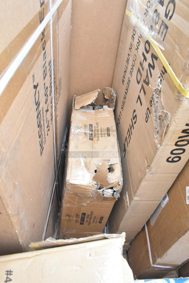 Stack of brand new items in damaged boxes, including evaporator coil and shelves. Visible labels include Regency and Lancaster.