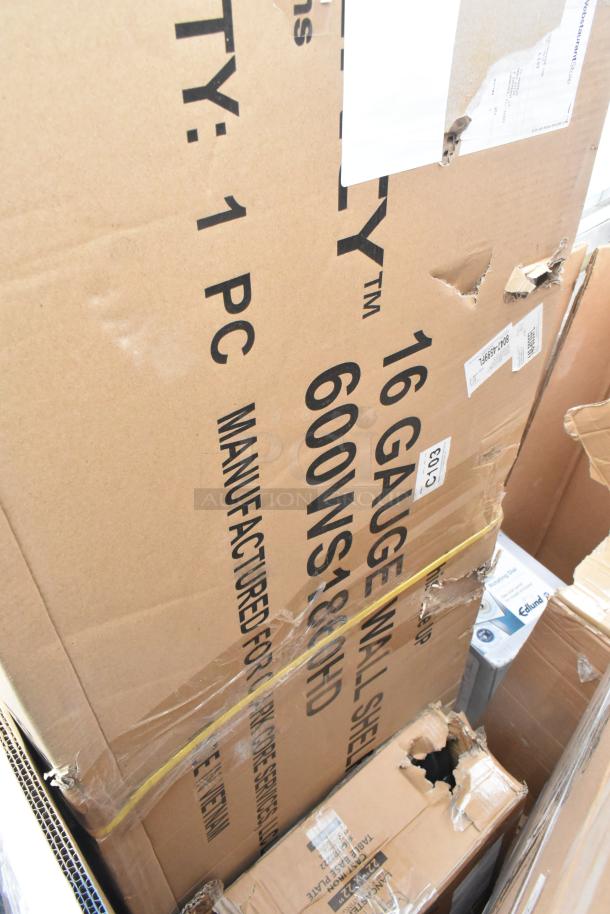 Cardboard boxes labeled "16 Gauge Wall Shelf" and "Evaporator Coil." Boxes show minor dents and scuffs.