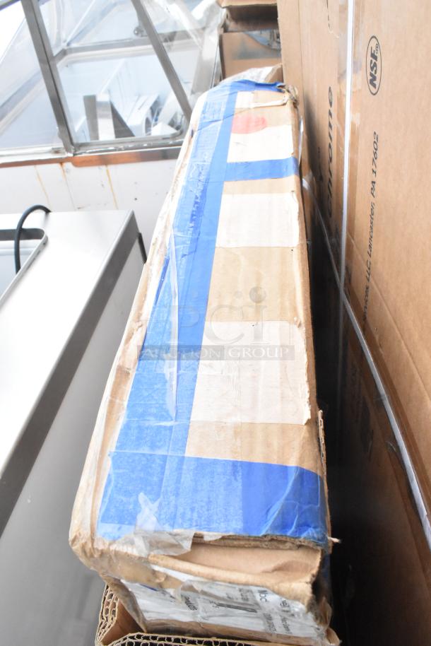 Cardboard box with blue tape labeled "Chrome NSF" containing a brand new evaporator coil, scale, and shelves. Scratch and dent condition.