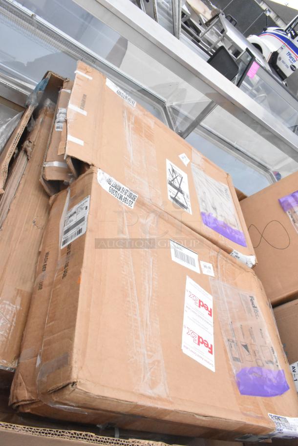 Cardboard boxes labeled "FedEx" containing brand new scratch and dent items. Includes trays and bussing carts.