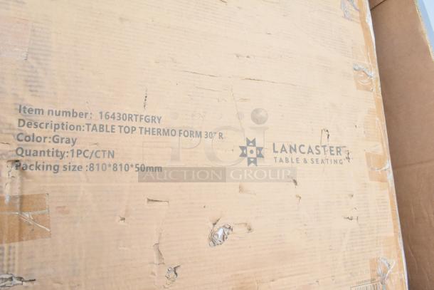 Cardboard box labeled "Lancaster Table & Seating" table top, grey, item #16430RTFGRY, 1 piece, dimensions 810x810x50mm.
