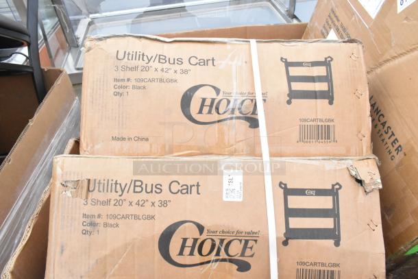 Cardboard boxes of brand new Choice utility/bus carts, 3 shelves, model 109CARTBLGBK, black, visible markings and labels.