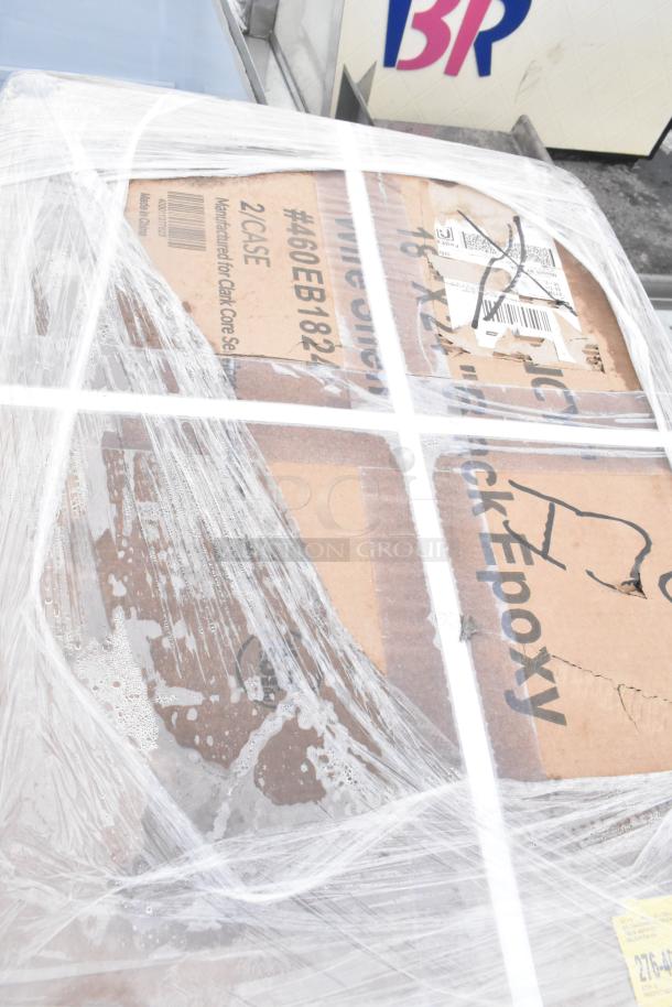 Pallet with boxes of wire shelves, labeled "460EB182". Wrapped in plastic. New condition, scratch and dent items.