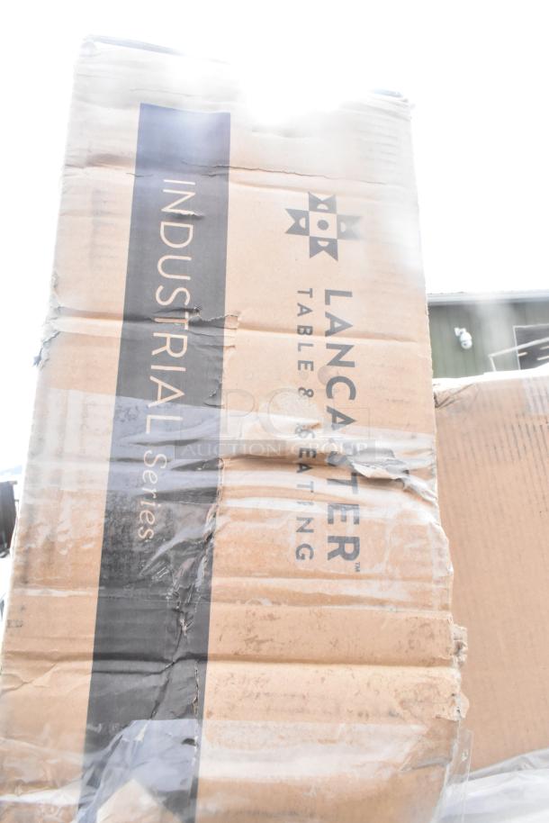 Box labeled "Lancaster Table & Seating Industrial Series" with visible wear, part of 17 scratch and dent items.