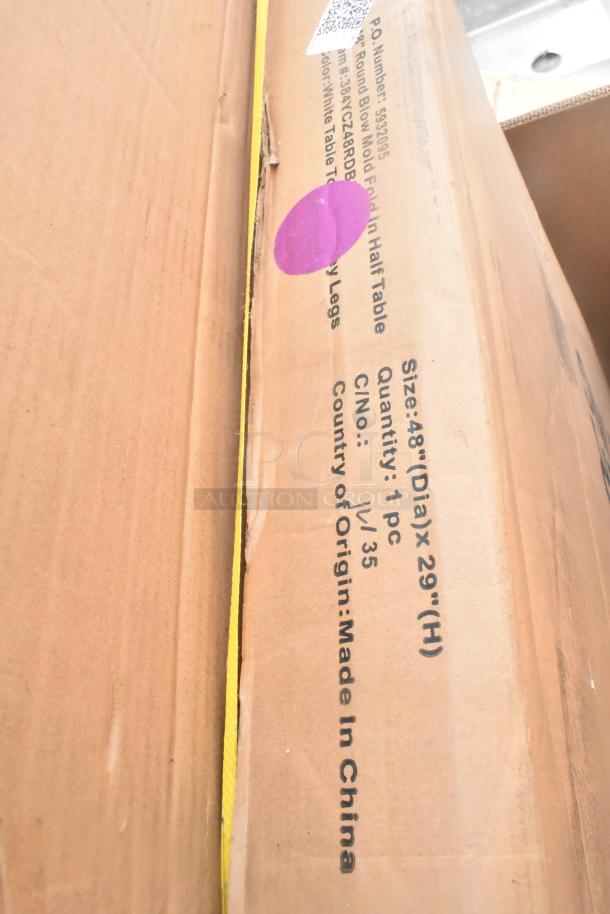 Cardboard box for a 48" round blow mold folding half table, made in China, marked with a purple sticker.