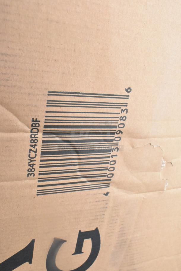 Cardboard box featuring barcode and minor dents, containing 17 new items such as a table and platform truck; some items marked as scratch and dent.