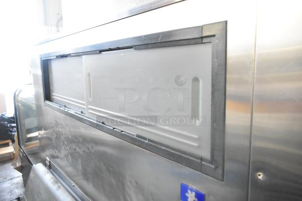 Manitowoc commercial ice head on Manitowoc F1475 ice bin, 208-230V, 1 Phase, stainless steel, sliding door visible, good condition.