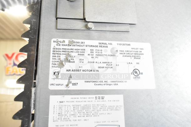 Manitowoc Commercial Ice Head on F1475 Ice Bin, 208-230V, 1 Phase. Label shows model 303W-261, serial 1101207048, R404A refrigerant.