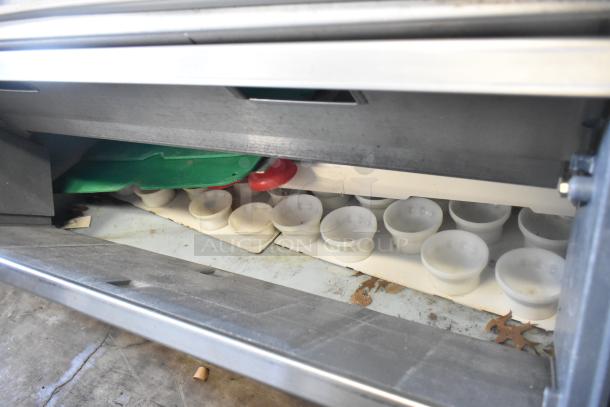 Manitowoc commercial ice machine head on F1475 ice bin, showing interior and ice molds, 208-230V, 1 phase.