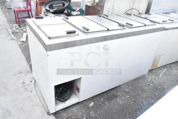 Master-Bilt DC-10D commercial chest freezer on casters, stainless steel lids, 208-230V, 1 phase, used condition.