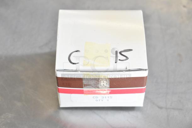 Lot of various items including a Rolls-Royce branded box, CD 3115, QTY 1, marked with "C 15". Box on metallic surface.