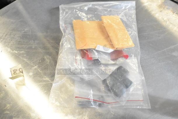 Clear plastic bag with various items including envelopes, screws, and light bulbs. Item tag marked "031".