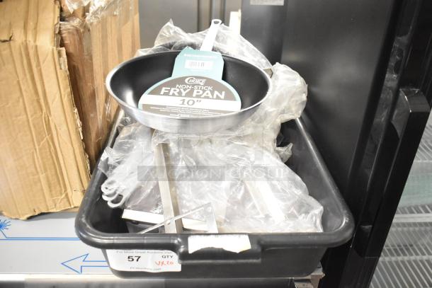 20 brand new scratch and dent items including a Choice 10" aluminum non-stick fry pan in a cardboard box. Labels visible.