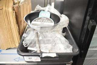 20 brand new scratch and dent items including a Choice 10" aluminum non-stick fry pan in a cardboard box. Labels visible.