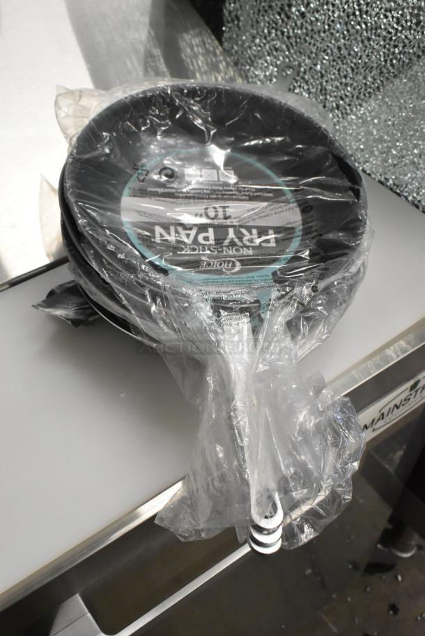 Bundle of 20 new items featuring Choice 407FRYPANNS 10" non-stick aluminum fry pan and 267020002 stainless steel bouillon spoon.