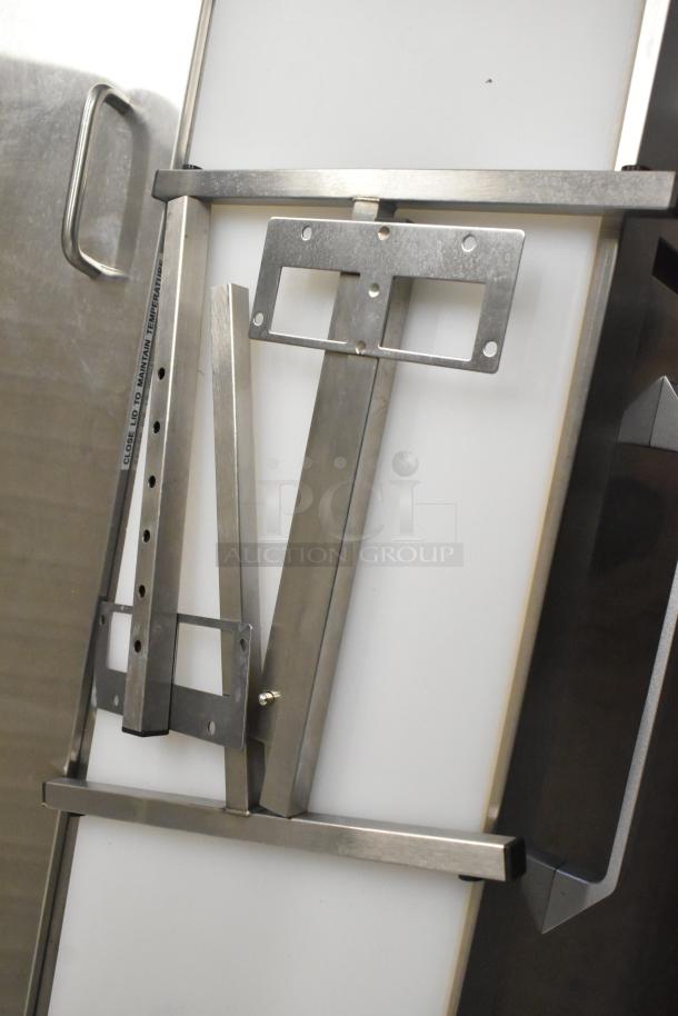 Stainless steel kitchen rack assembly parts, new condition, with visible mounting brackets and adjustable arms.