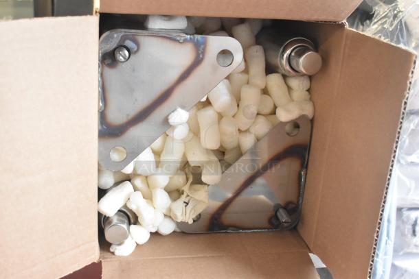 Cardboard box containing packaged components for 2025 Blodgett ZEPHAIRE-200-G convection oven. Contains packing peanuts and metal parts.