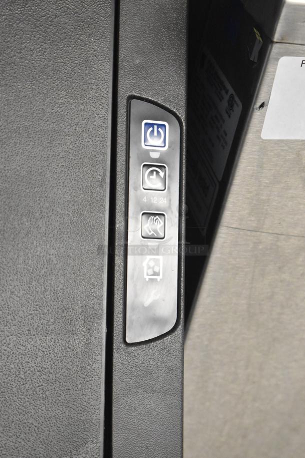 Brand new Manitowoc UDF0310A-261Z commercial dishwasher, control panel view, showing power and cycle icons.