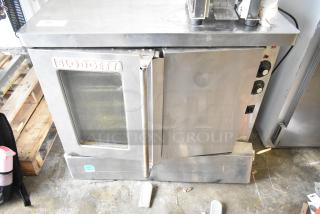 Blodgett commercial full-size convection oven with solid and view-through door, thermostatic controls, used condition.