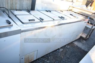 Kelvinator commercial chest freezer with multiple lids, on commercial casters. 208-230 volts, 1 phase. Used condition.
