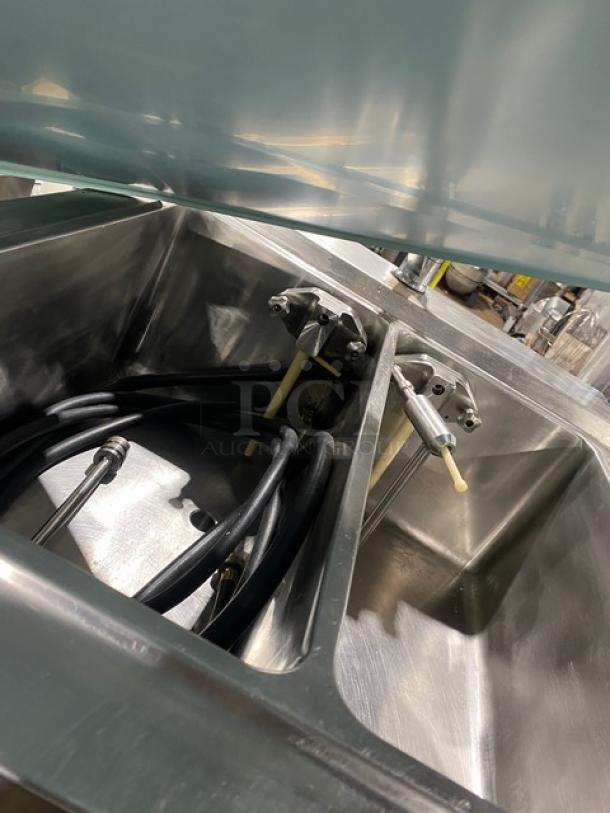 ColdElite UF820-2 stainless steel ice cream machine interior, showing twin/twist mechanisms and hoses. Clean, on casters.