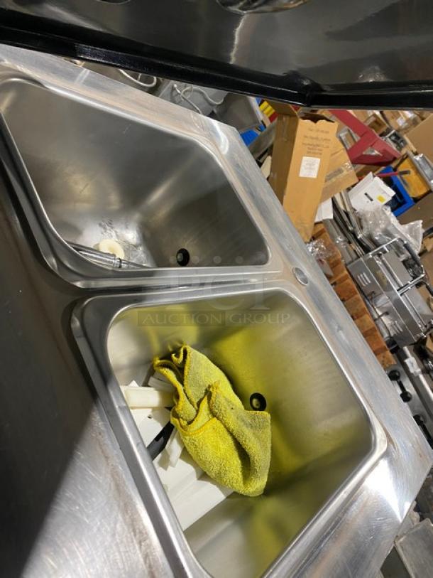 Electro Freeze commercial stainless steel soft serve machine with two hoppers, visible interior, and accessories.