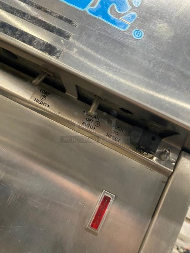 Electro Freeze stainless steel soft serve machine with day/night switch, timer, and reset button visible.