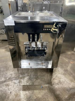 Elvaria Model 515 twin/twist soft serve machine, stainless steel, 2 hoppers, 3 dispensers, digital display, on casters.