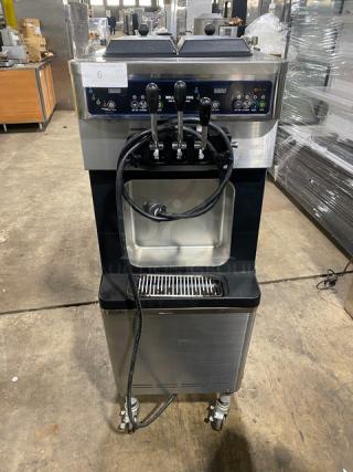 Well Spring SSI-143S twin/twist soft serve machine, stainless steel, 3 dispensers, digital controls, drip tray, on casters.