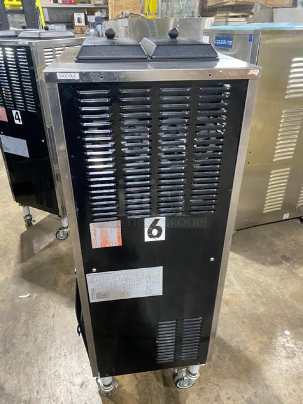 Well Spring SSI143S stainless steel soft serve machine, twin hoppers, three dispensers, drip tray, digital controls, on casters.