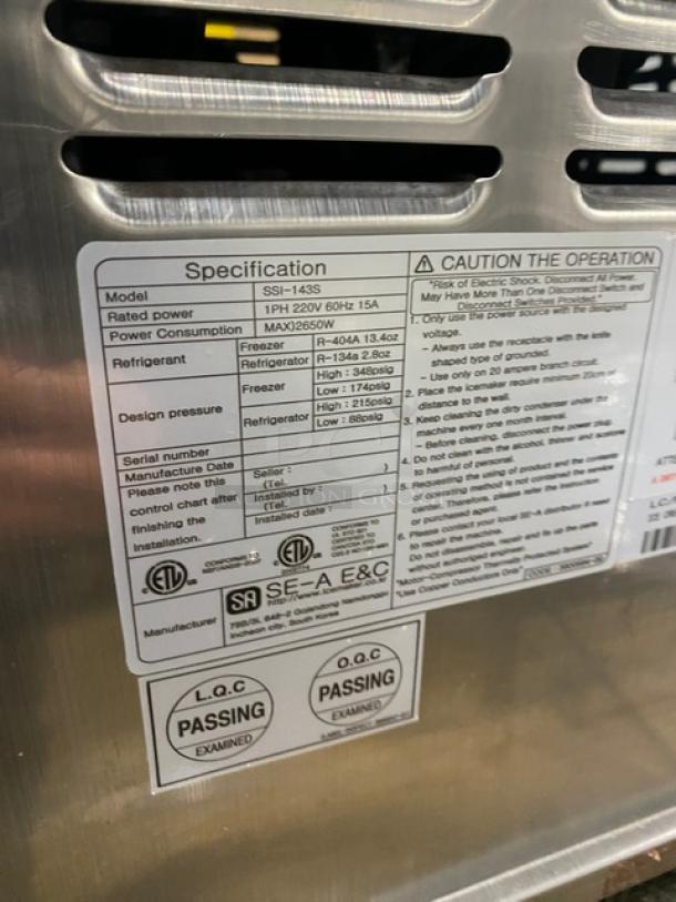 Stainless steel Well Spring SSI-143S soft serve machine, 2 hoppers, 3 dispensers, digital controls, on casters, 220V, model info visible.