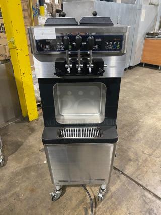 Well Spring SSI143S stainless steel twin/twist soft serve machine, 2 hoppers, 3 dispensers, digital controls, on casters.