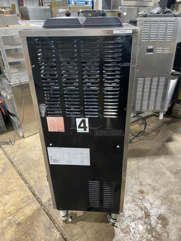 Well Spring SSI-143S stainless steel soft serve machine, features 2 hoppers, 3 dispensers, digital controls, on casters.