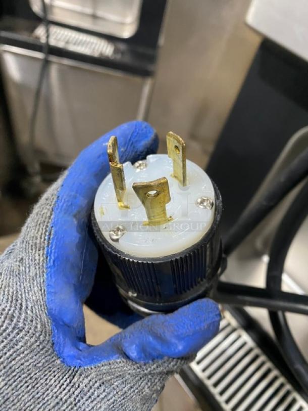 Plug from Well Spring SSI143S ice cream machine, 220V 1 Phase. Shows power connector configuration and condition.