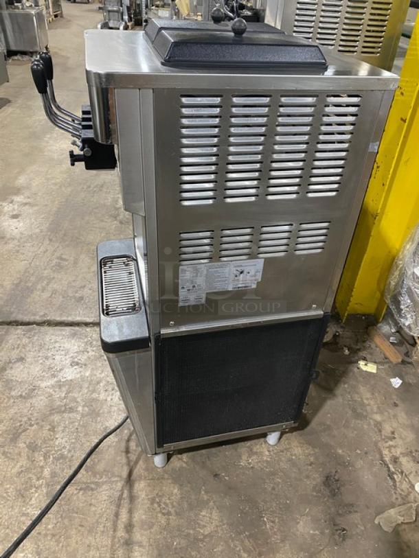 Well Spring SSI-143S soft serve machine, stainless steel, 2 hoppers, 3 dispensers, drip tray, digital controls, on casters.