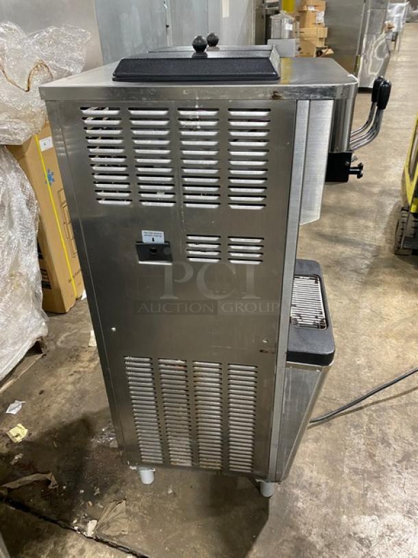 Well Spring SSI-143S stainless steel ice cream machine, twin/twist, 2 hoppers, 3 dispensers, digital controls, drip tray, casters.