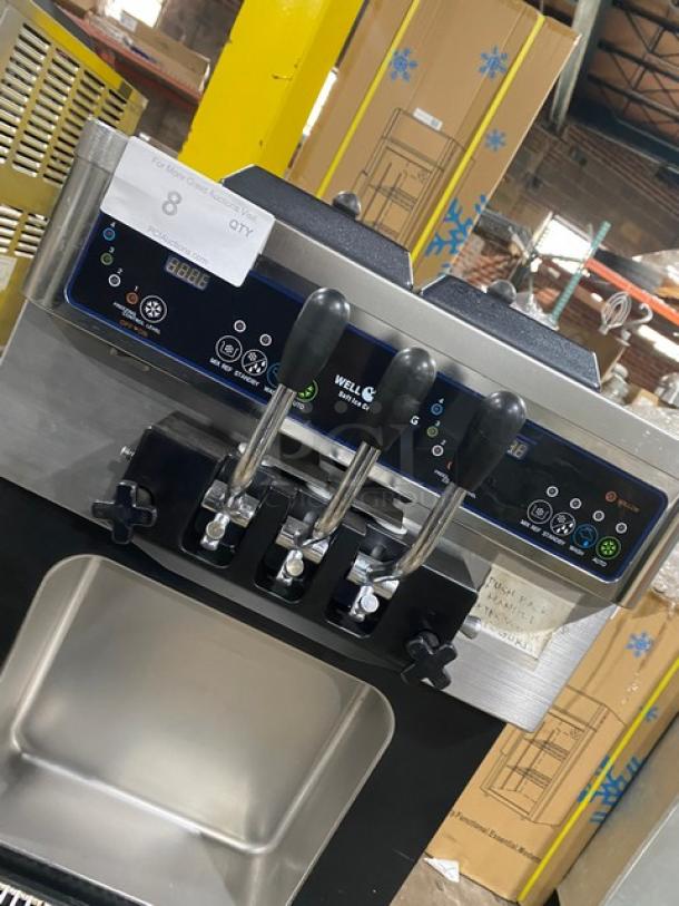 Well Spring SSI143S stainless steel soft serve machine, 2 hoppers, 3 dispensers, digital controls, casters, 220V.