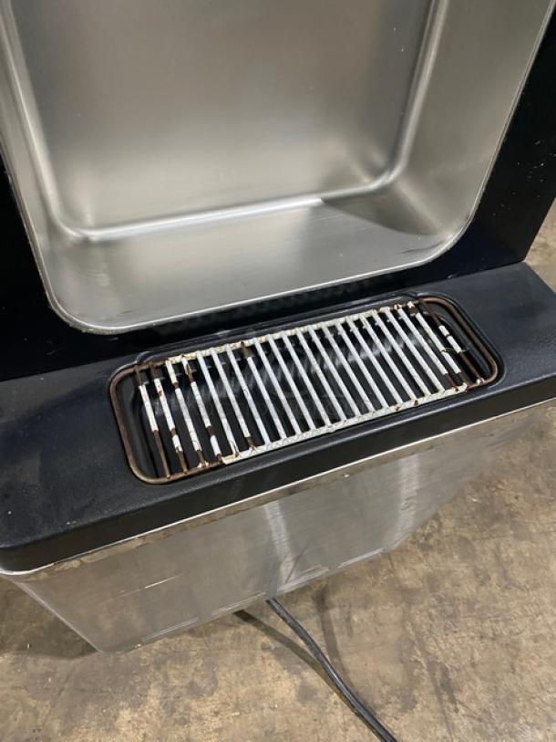 Well Spring SSI143S stainless steel soft serve machine, features 2 hoppers, 3 dispensers, drip tray, digital controls, casters.