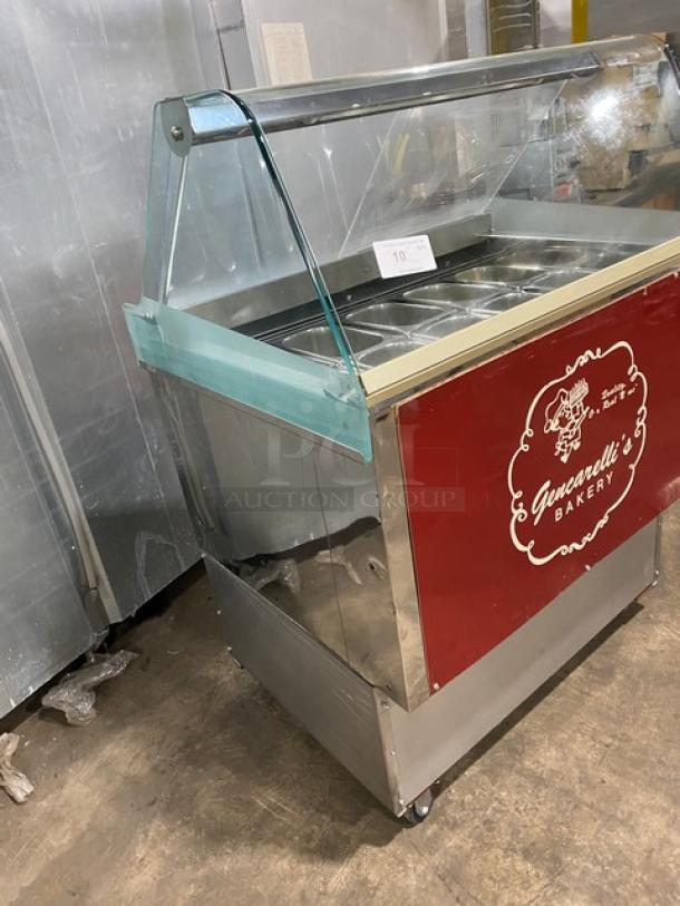 Gencarelli's Style stainless steel 10-pan gelato case, with rear sliding doors and casters, featuring bakery branding.