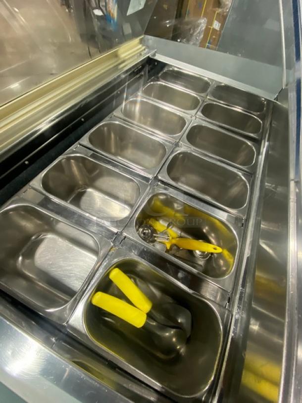 Gencarelli's commercial stainless steel 10-pan gelato case, excellent condition, rear sliding door, on casters, visible interior pans.