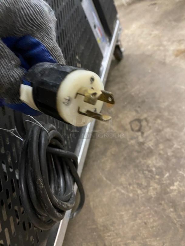 Stainless steel commercial gelato case with 10-pan capacity, rear sliding doors, and casters; electric plug shown.