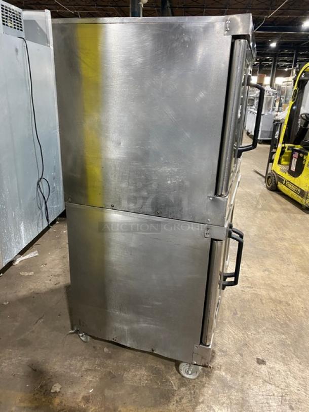 Vulcan VC4GD-11D150K commercial stainless steel double stacked convection oven on casters, side view.