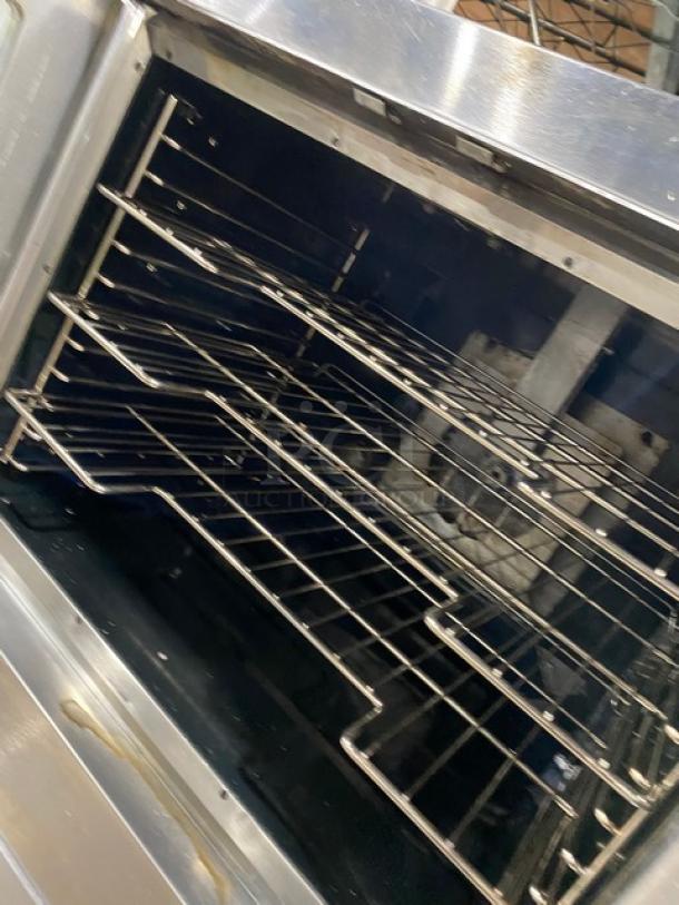 Vulcan VC4GD11D150K stainless steel gas convection oven, double stacked, wired rack, on casters, commercial use.