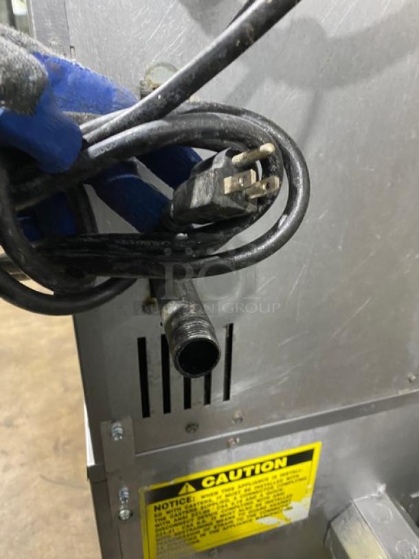 Vulcan VC4GD-11D150K commercial stainless steel gas-powered convection oven on casters with wiring, caution label visible.